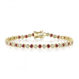 A 14K Yellow Gold Bezel Set Tennis Bracelet
