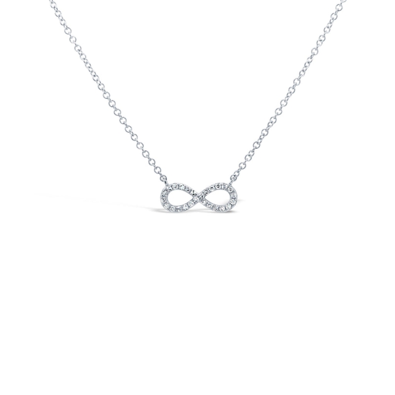A 14K White Gold Open Infinity Pendant That Is Set With 26 Diamonds Weighing .08 Carat Total. G/H, Vs-Si. It Is Stationed To A Fine Cable Link Chain Measuring 18 In Length.