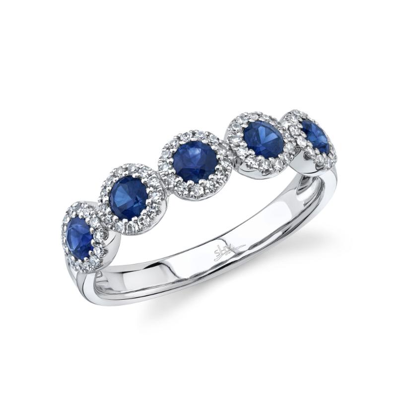 A 14K White Gold Five Stone Blue Sapphire Band Totaling .70 Carat. Each Stone Is Surrounded By A Halo Of Diamonds Weighing .20 Carat Total.